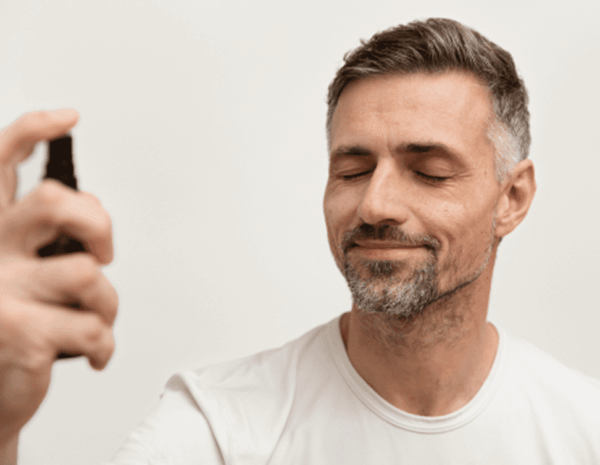 man-using-anti-aging-treatment@2x